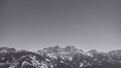 Monochromatic mountain landscape under a starscape, representational of business scaling and fractional marketing leadership for Plate Lunch Collective.